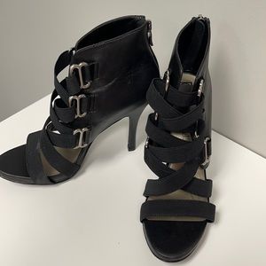 Black leather booties with cute strap details!